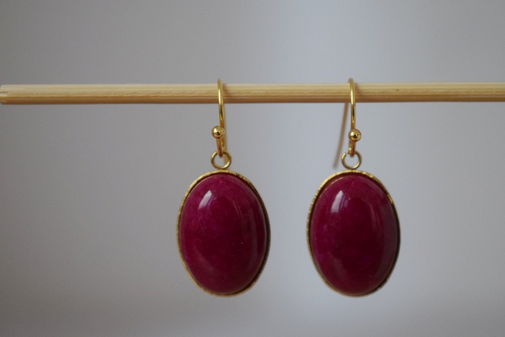 Red Jade Dangle Earrings: Gold Plated Oval Gemstone