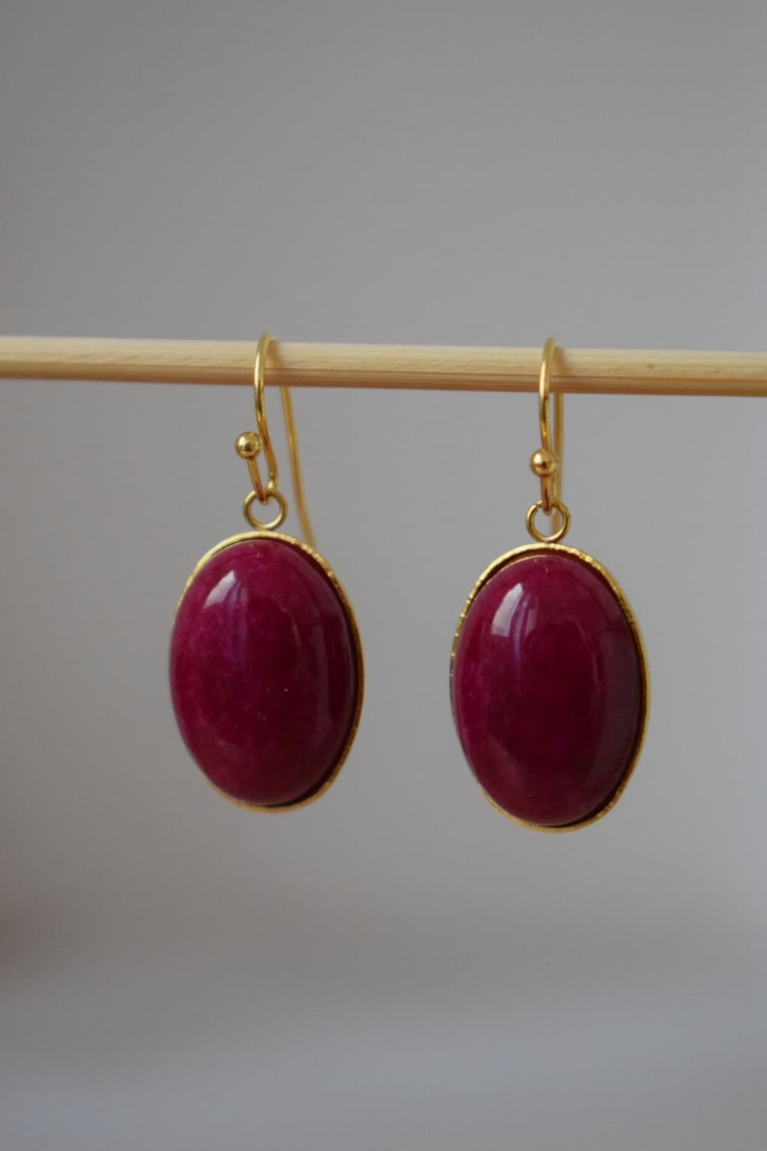Red Jade Dangle Earrings: Gold Plated Oval Gemstone