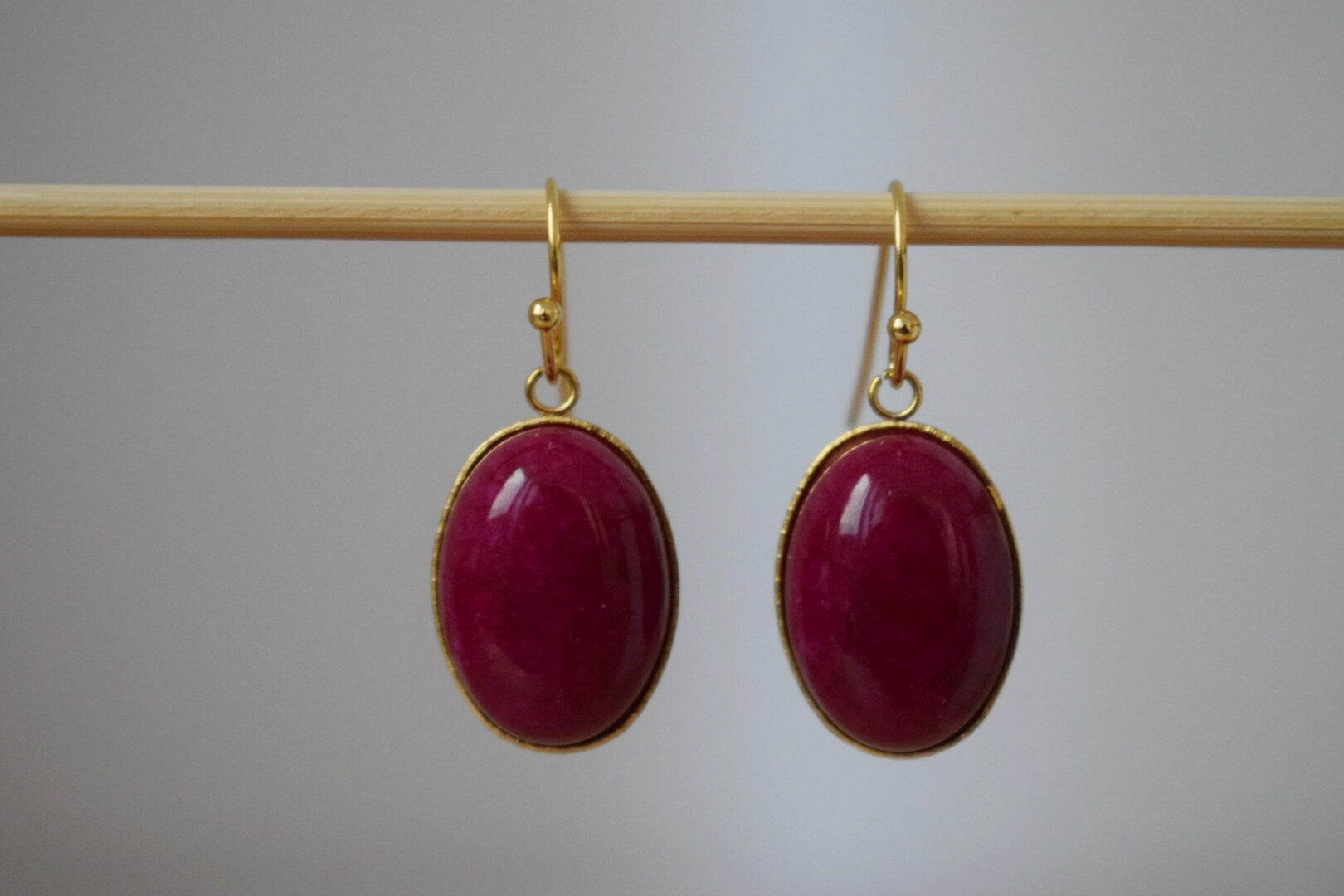 Red Jade Dangle Earrings: Gold Plated Oval Gemstone