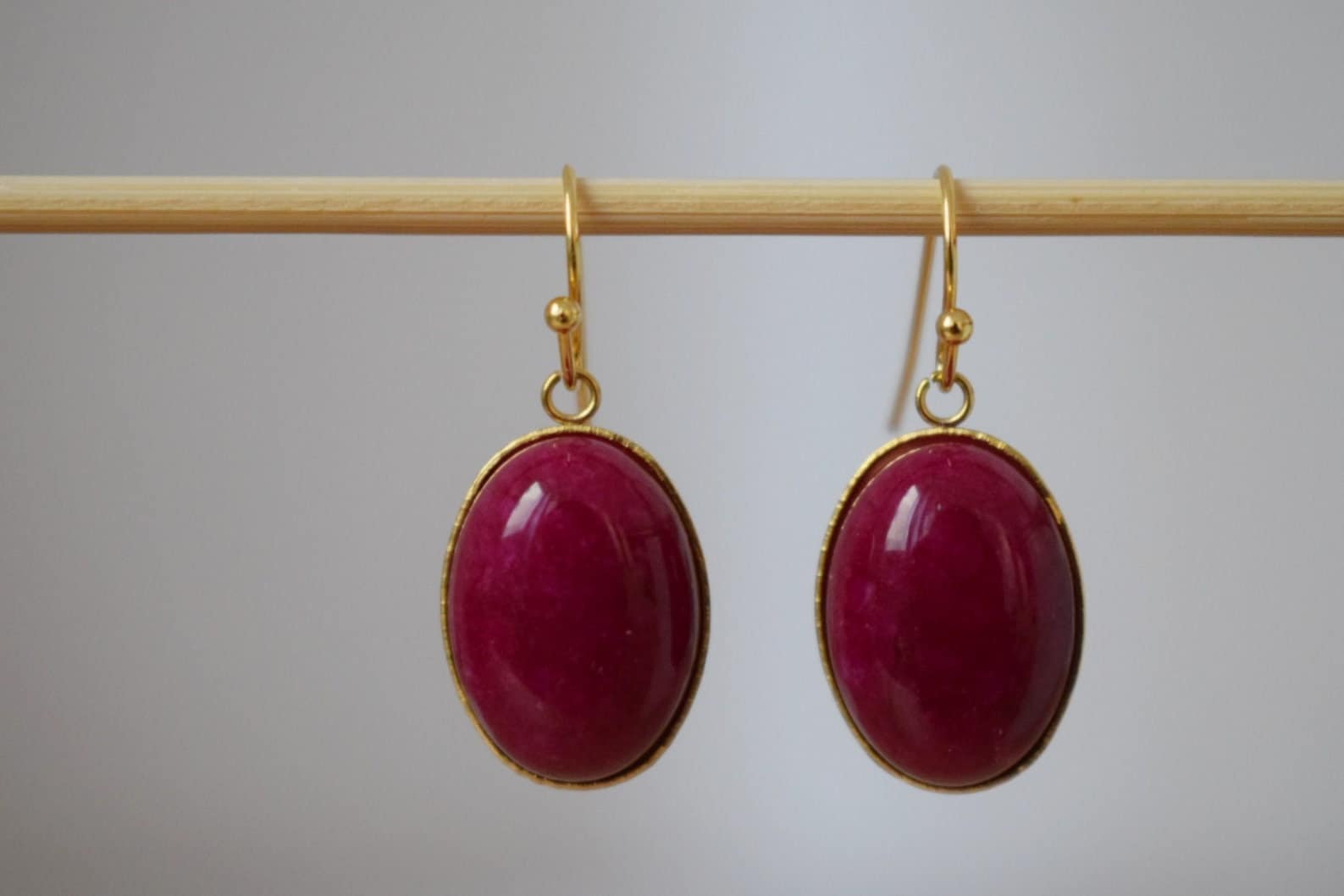 Red Jade Dangle Earrings: Gold Plated Oval Gemstone